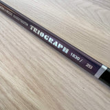 Koh-I-Noor Triograph pencil on a wooden surface