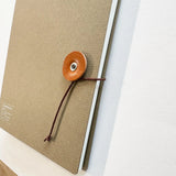 Kleid String Tie Square Notebook Camel