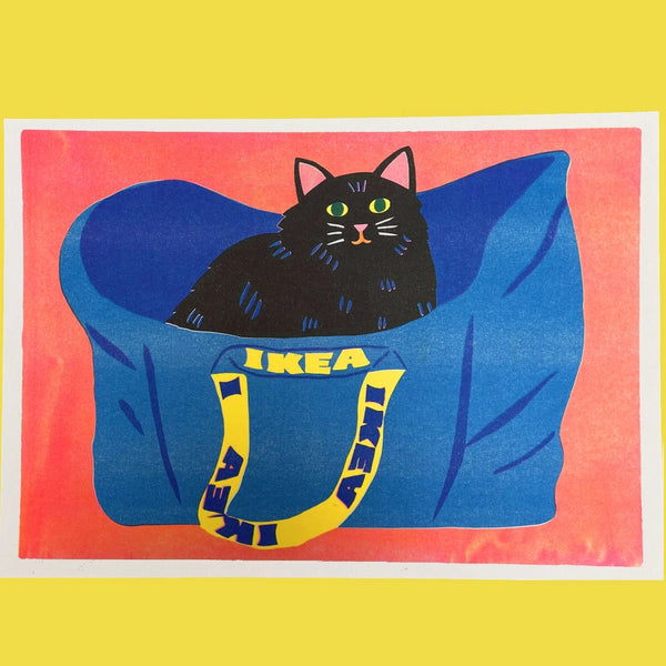 Cartoon black cat sitting in a blue IKEA bean bag chair on a yellow background