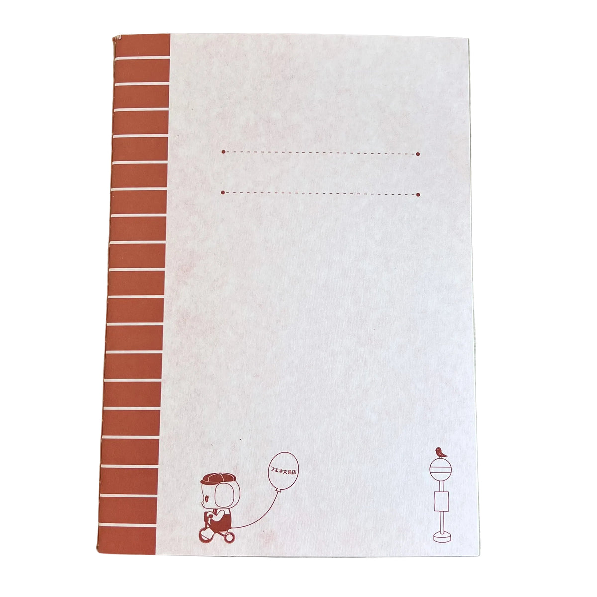 Notebook with red striped design and small illustrations on a wooden surface