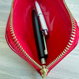 Interior of Life leather pen case red with pens isnide