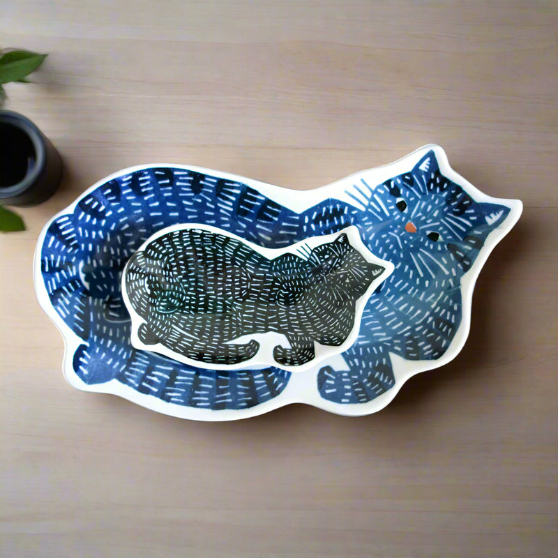 Sticker of a blue and black cat on a wooden surface