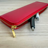 Life leather pen case red with pens sticking out