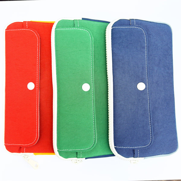 Three fabric pouches in red, green, and blue on a white background