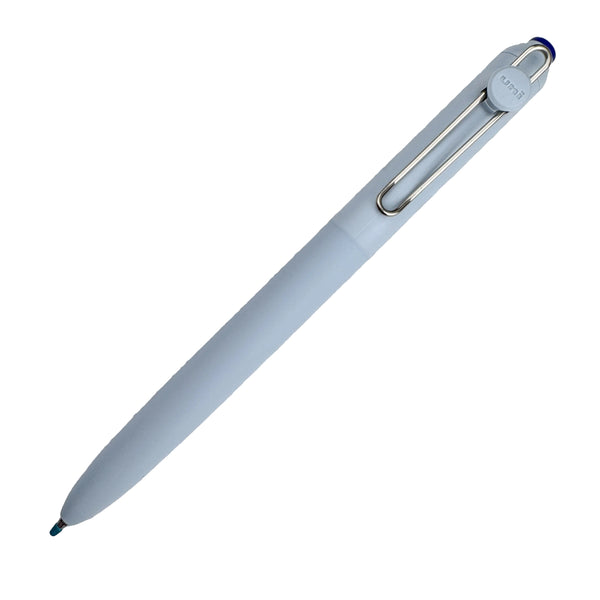 Light blue pen on a textured white surface